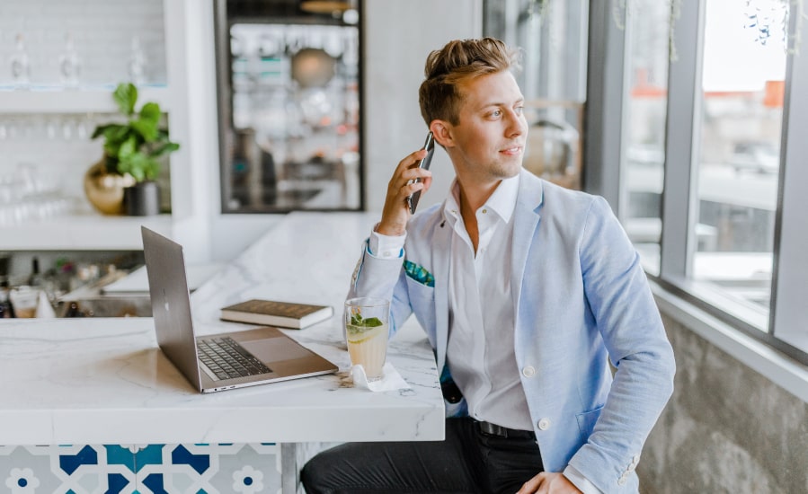 Man in business phone looking out the window